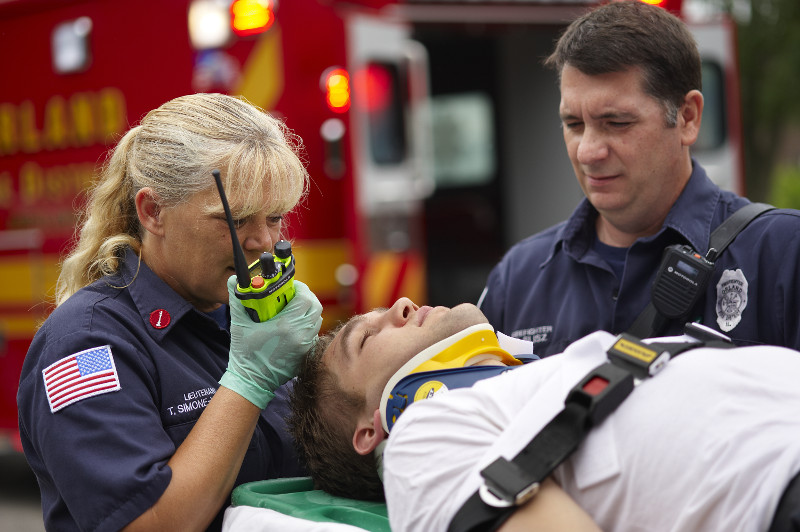 First responder using radio supported by ERCES Systems for reliable Fire and EMS communication